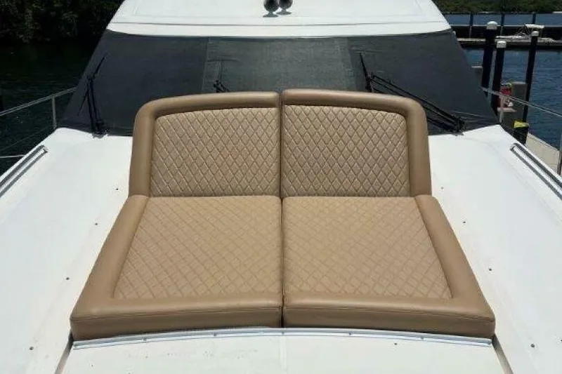 Slide: The Image of Luxurious seating on 2006 Princess 67 Flybridge yacht, featuring quilted tan cushions. - 15