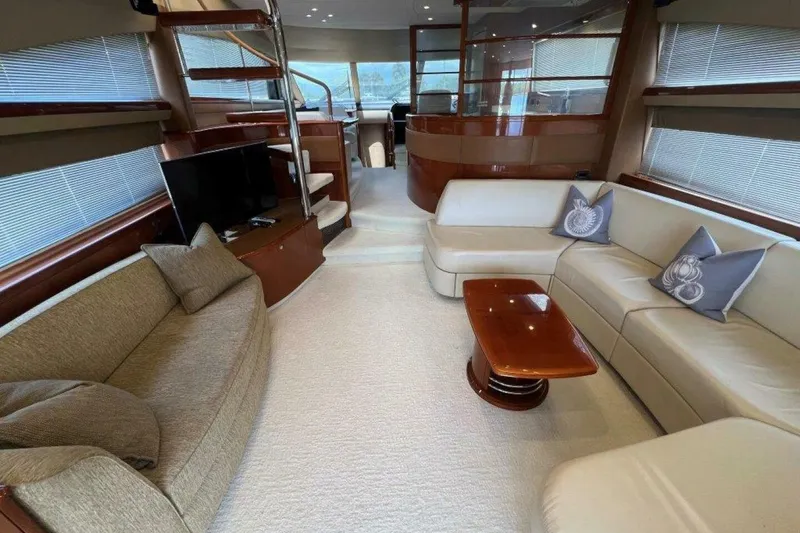 Slide: The Image of Luxurious interior of a 2006 Princess 67 Flybridge yacht with elegant seating and modern decor. - 16