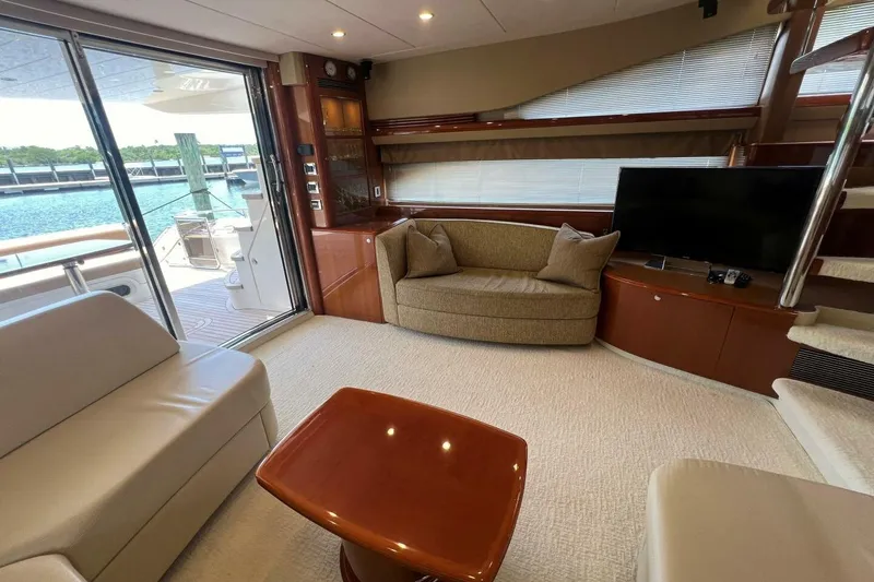 Slide: The Image of Luxurious interior of 2006 Princess 67 Flybridge yacht with elegant seating and modern amenities. - 18
