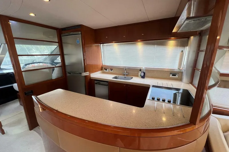 Slide: The Image of Luxurious kitchen interior of 2006 Princess 67 Flybridge yacht with modern amenities. - 21