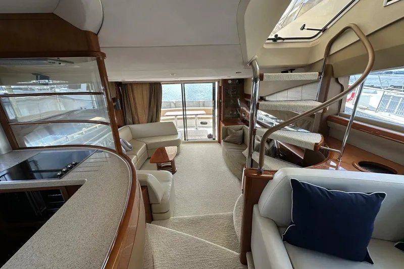 Slide: The Image of Luxurious interior of 2006 Princess 67 Flybridge yacht with elegant seating and modern design. - 22