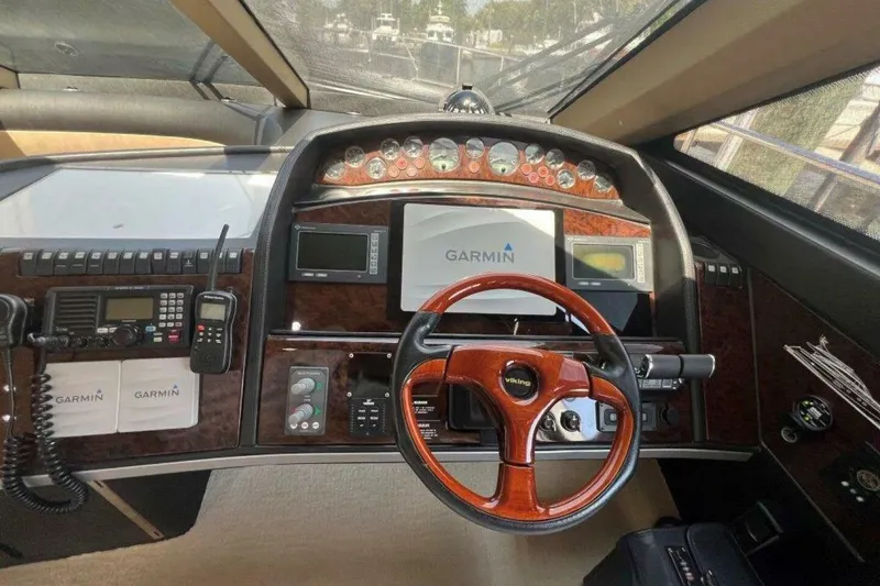 Slide: The Image of Cockpit of 2006 Princess 67 Flybridge yacht with Garmin navigation system and Viking steering wheel. - 24
