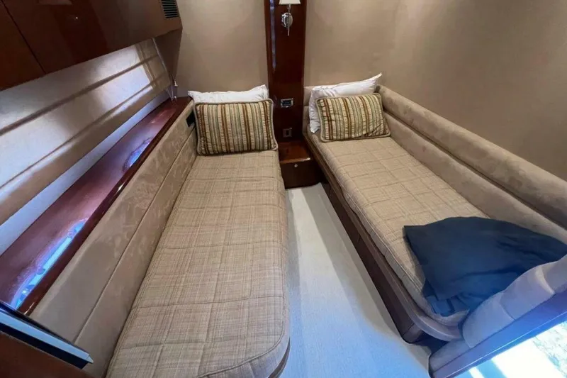 Slide: The Image of Interior of 2006 Princess 67 Flybridge yacht with twin beds and elegant decor. - 28