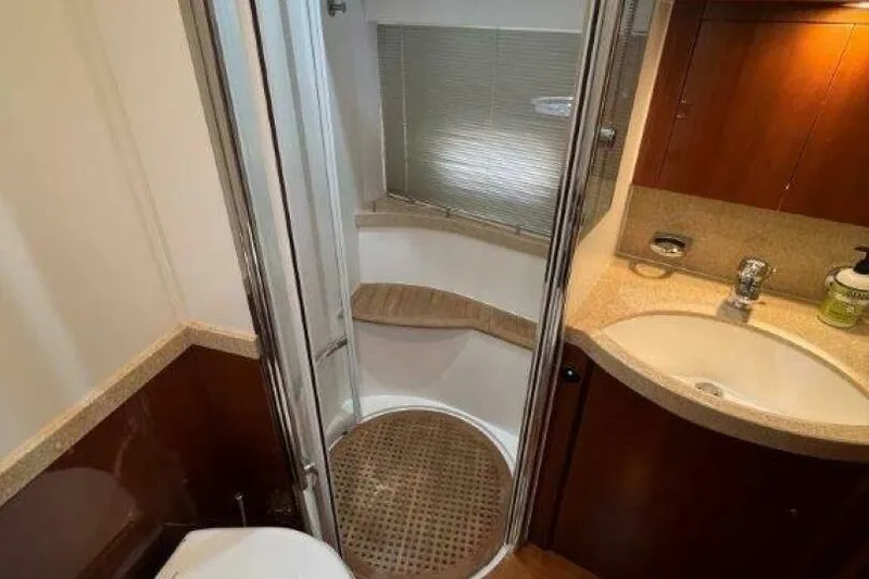 Slide: The Image of Luxurious bathroom in 2006 Princess 67 Flybridge yacht with shower and sink. - 29
