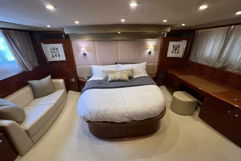 Slide: The Image of Luxurious bedroom interior of 2006 Princess 67 Flybridge yacht with elegant decor and cozy seating. - 30