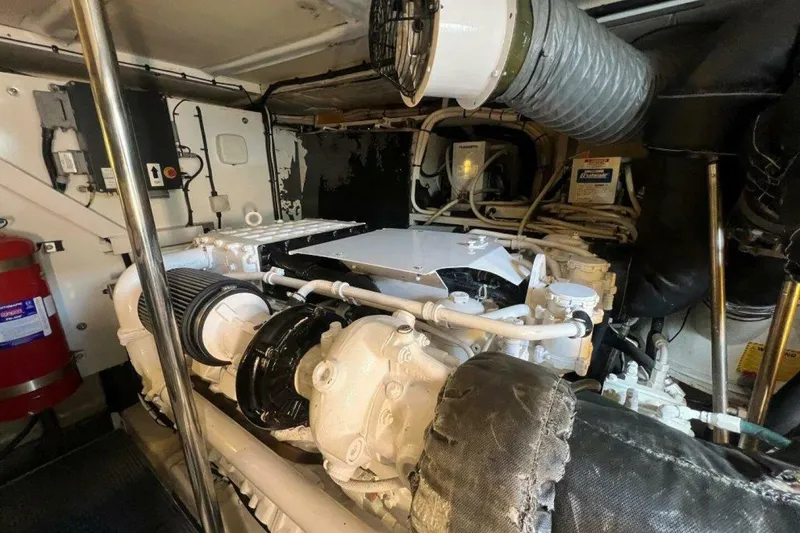 Slide: The Image of Engine room of a 2006 Princess 67 Flybridge yacht, showcasing mechanical components. - 35