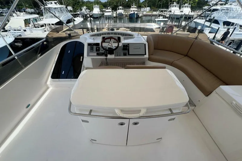 Slide: The Image of Luxurious 2006 Princess 67 Flybridge yacht interior with helm and seating area. - 8
