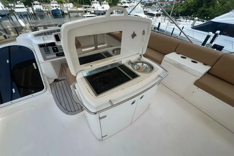 Slide: The Image of Flybridge of 2006 Princess 67 yacht with grill and seating area. - 9