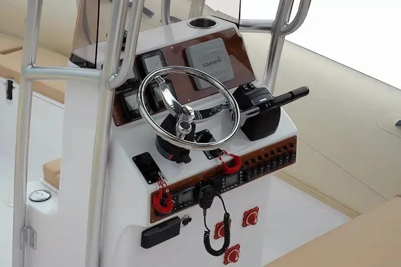 Slide: The Image of 2026 AB Inflatables Oceanus 24 VST boat console with steering wheel and navigation equipment. - 3