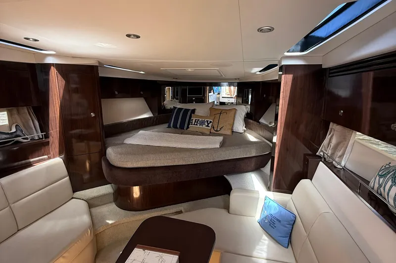 Slide: The Image of Luxurious interior of 2015 Sea Ray 350 Sundancer yacht with elegant seating and bedding. - 22