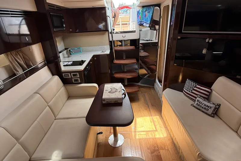 Slide: The Image of Luxurious interior of 2015 Sea Ray 350 Sundancer yacht with cozy seating and modern amenities. - 28