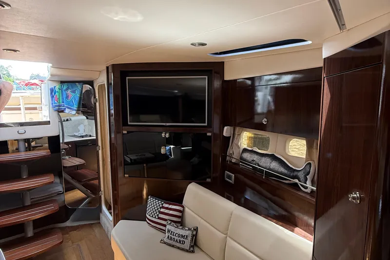 Slide: The Image of Interior of 2015 Sea Ray 350 Sundancer yacht with cozy seating and modern amenities. - 29