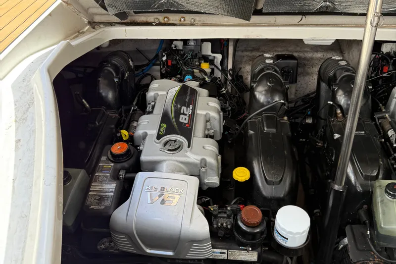 Slide: The Image of Engine compartment of a 2015 Sea Ray 350 Sundancer with a powerful V8 engine. - 36