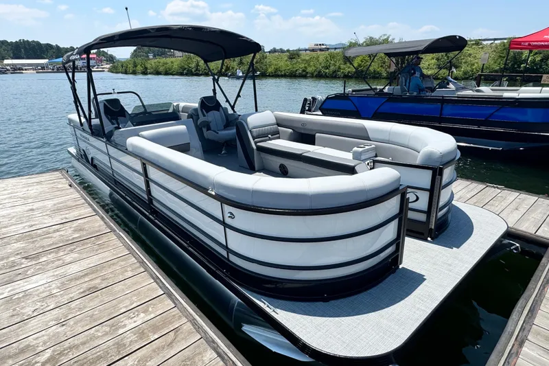 Slide: The Image of 2026 Veranda Vista Sport VS25RC pontoon boat docked on a sunny day. - 3