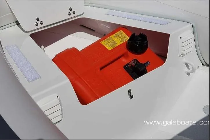 Slide: The Image of Open storage compartment with red fuel tank in a 2025 Gala A360D boat. - 8