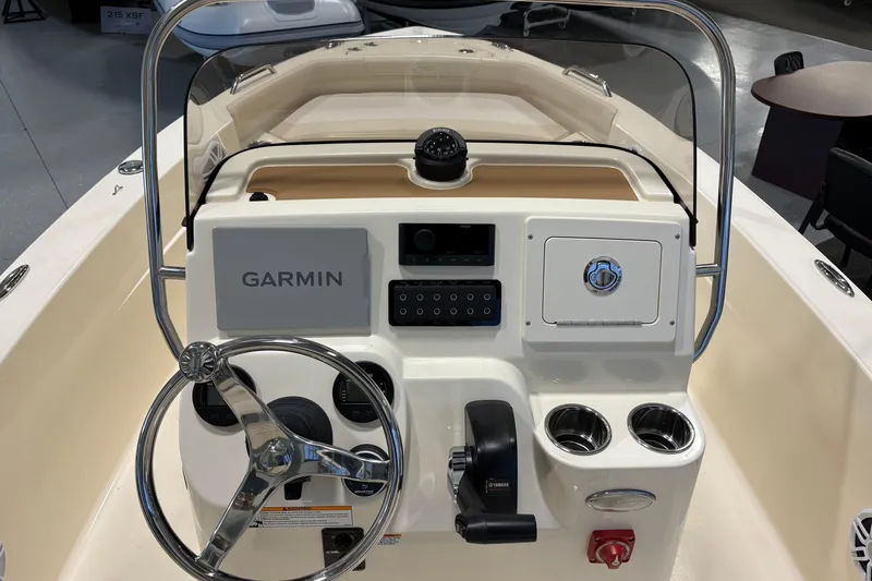 Slide: The Image of 2026 Scout 188 Sportfish boat dashboard with Garmin navigation and Yamaha controls. - 6