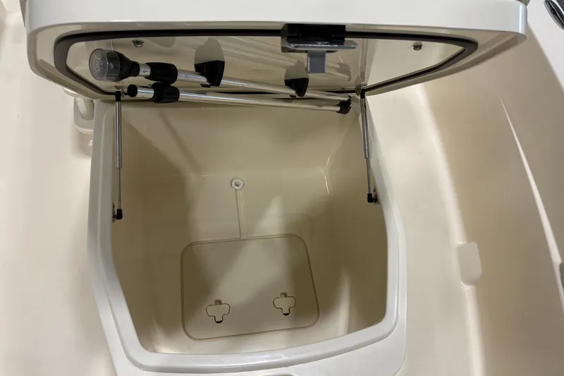 Slide: The Image of Open storage compartment in 2026 Scout 188 Sportfish boat. - 9