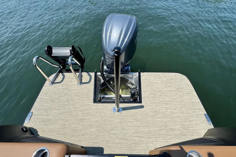 Slide: The Image of 2026 Veranda Vertex VX285DCRC boat stern with motor and swim platform on water. - 14