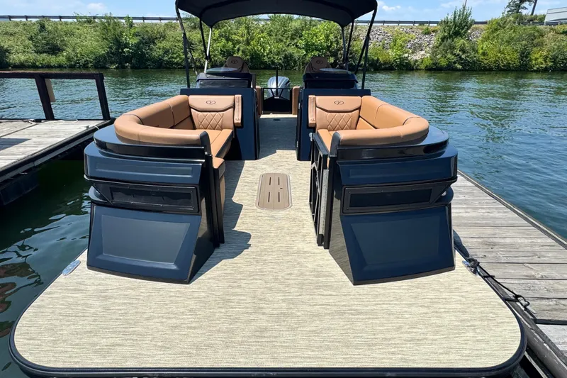 Slide: The Image of 2026 Veranda Vertex VX285DCRC pontoon boat with luxurious seating on a serene lake. - 3