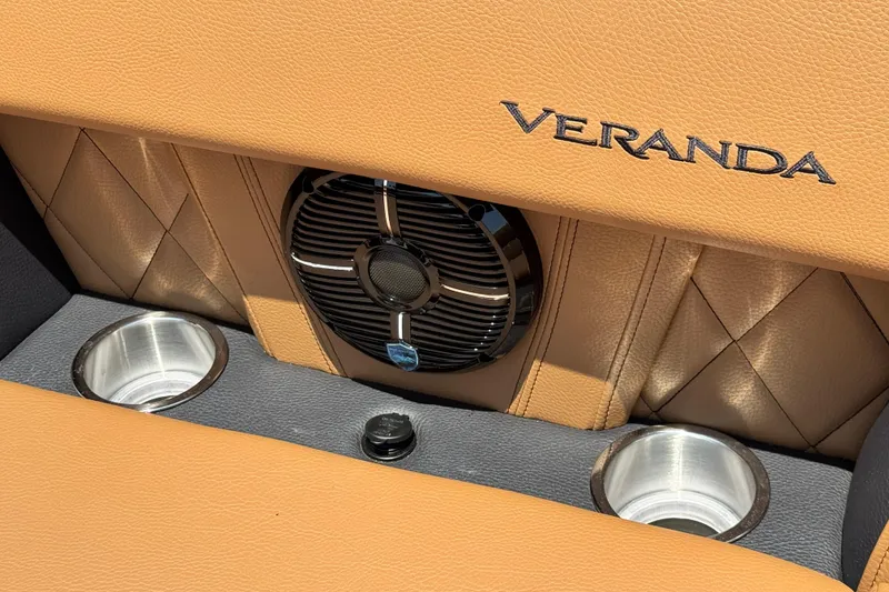 Slide: The Image of Luxurious Veranda Vertex VX285DCRC 2026 interior with tan leather, speaker, and cup holders. - 6