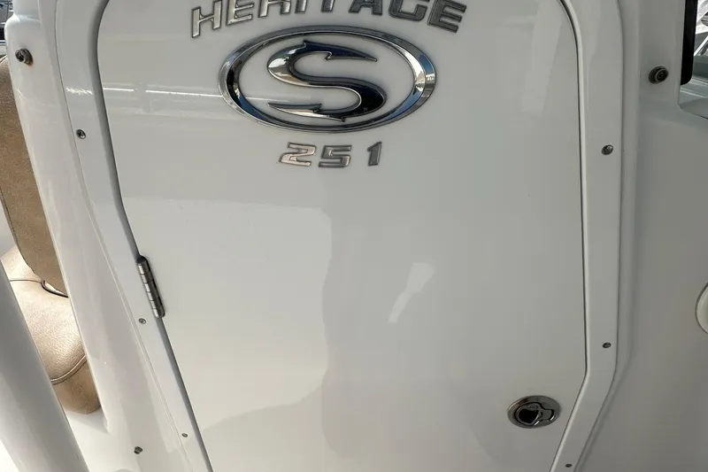 Slide: The Image of 2020 Sportsman Heritage 251 Center Console boat emblem and door detail. - 22