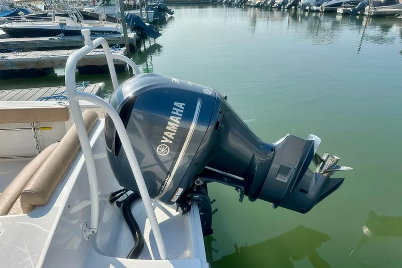 Slide: The Image of 2020 Sportsman Heritage 251 Center Console with Yamaha outboard motor at marina. - 4