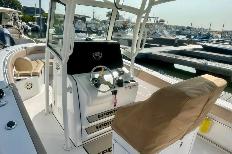 Slide: The Image of 2020 Sportsman Heritage 251 Center Console boat interior at marina dock. - 9