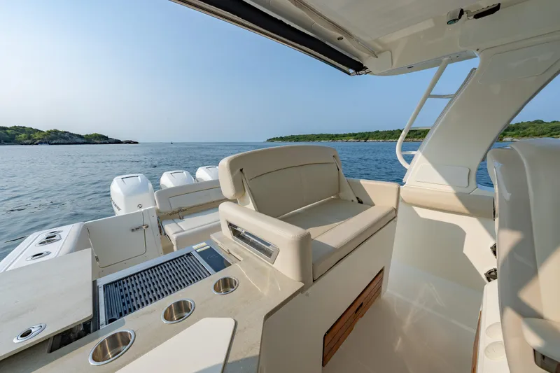 Slide: The Image of 2019 Boston Whaler 350 EX REALM boat interior with ocean view. - 14
