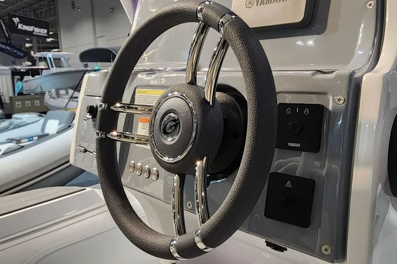 Slide: The Image of Steering wheel of a Gala V500 boat, 2026 model, at a show. - 5