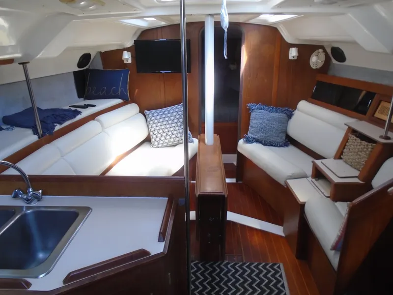 Slide: The Image of Interior of 1987 Hunter Legend 37 sailboat with cozy seating and modern amenities. - 10