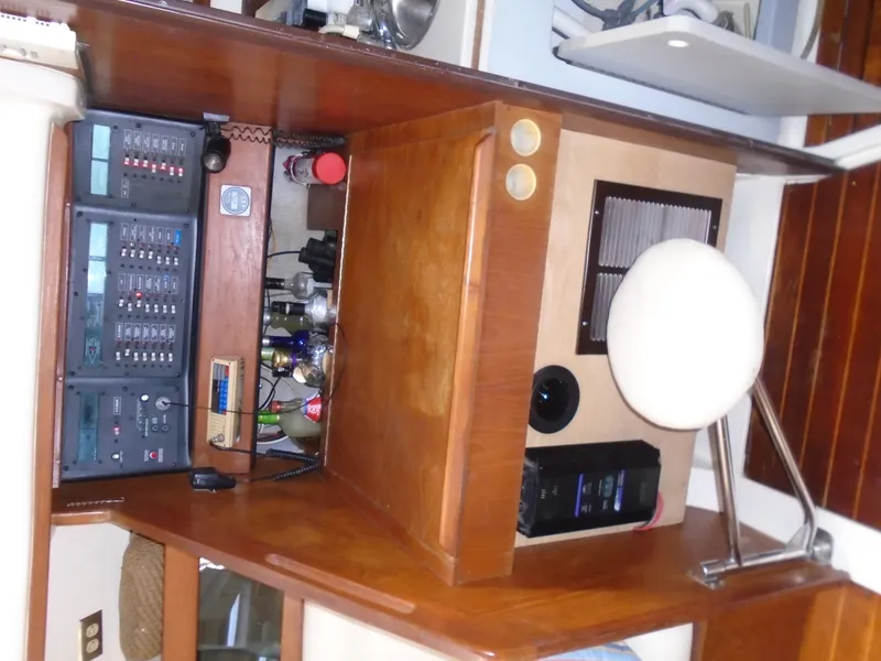 Slide: The Image of Interior of 1987 Hunter Legend 37 sailboat with navigation equipment and wooden cabinetry. - 2