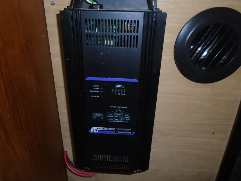 Slide: The Image of Battery charger in 1987 Hunter Legend 37 boat, mounted on wooden panel. - 9