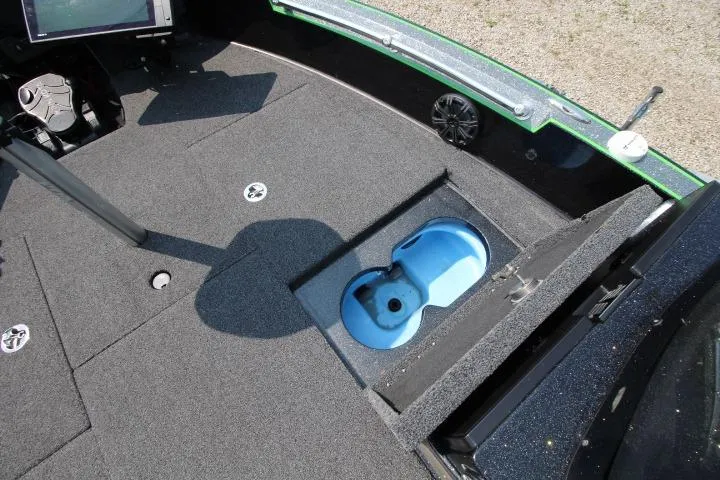 Slide: The Image of 2020 Nitro ZV20 Pro boat deck with open storage compartment and blue interior. - 12