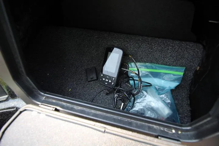 Slide: The Image of Storage compartment of 2020 Nitro ZV20 Pro with electronic device and cables. - 19