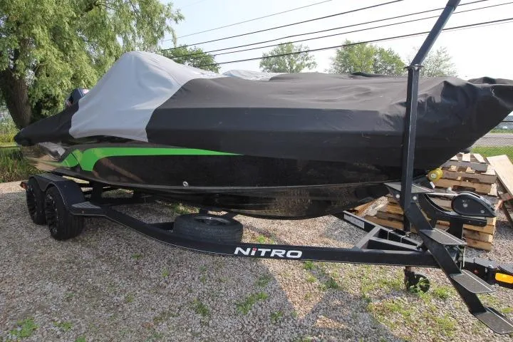 Slide: The Image of Covered 2020 Nitro ZV20 Pro boat on trailer, parked on gravel. - 21