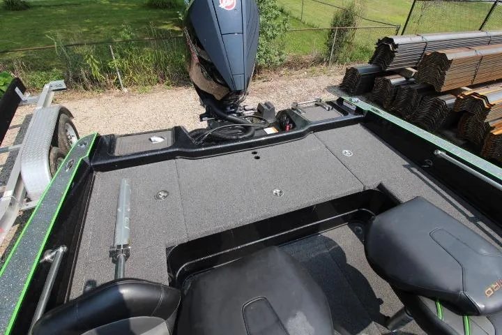 Slide: The Image of 2020 Nitro ZV20 Pro boat interior with motor, trailer, and storage compartments. - 6