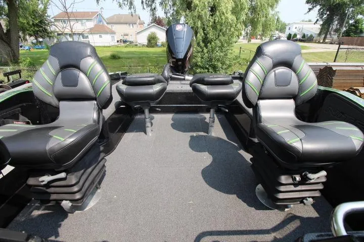 Slide: The Image of 2020 Nitro ZV20 Pro boat interior with black and green seating. - 7