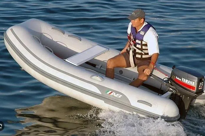 Slide: The Image of Man operating 2026 AB Inflatables Lammina 10 AL boat on water. - 6
