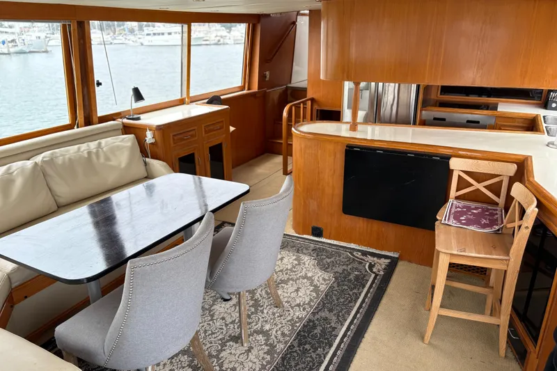 Slide: The Image of Luxurious 1990 Angel Pilothouse interior with elegant dining area and modern kitchen. - 14