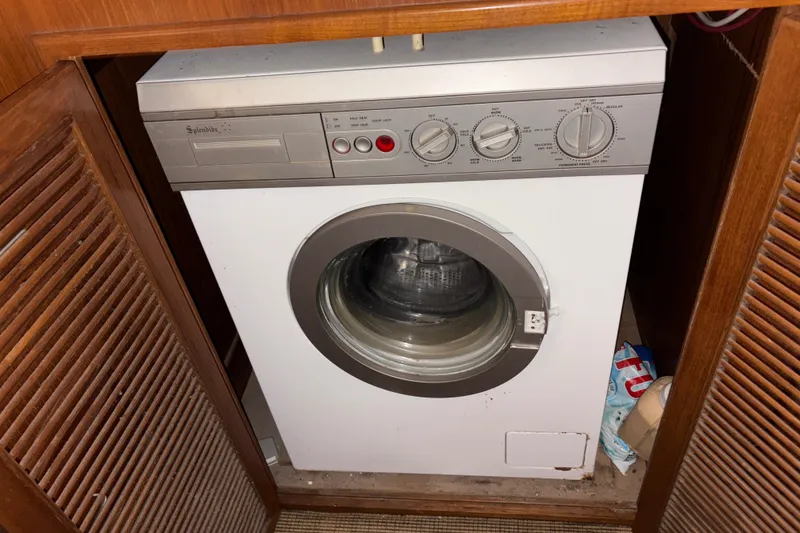 Slide: The Image of Front-loading washing machine in wooden cabinet on 1990 Angel Pilothouse boat. - 26