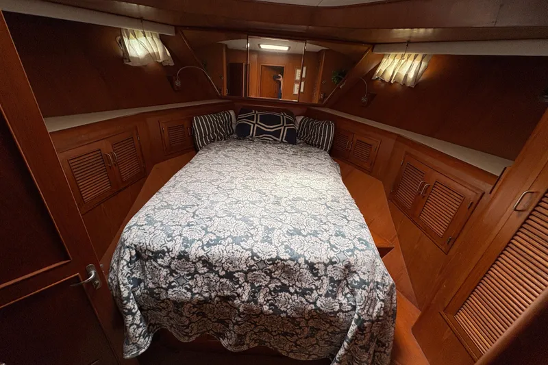 Slide: The Image of Luxurious 1990 Angel Pilothouse cabin interior with cozy bed and elegant wood finish. - 5