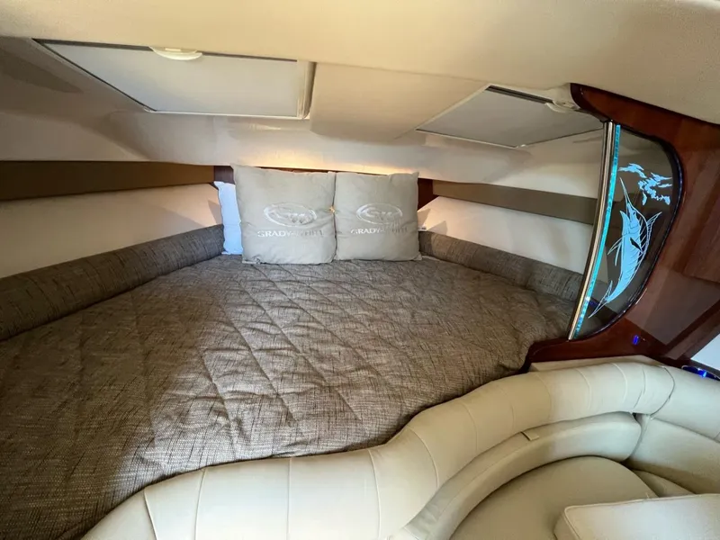 Slide: The Image of Luxurious cabin interior of 2019 Grady-White Express 370 with comfortable bedding. - 10