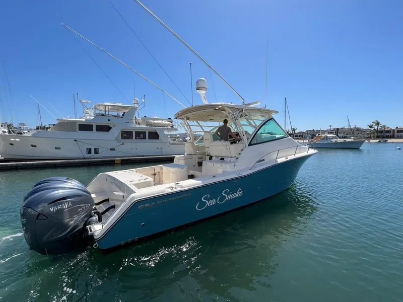 Slide: The Image of 2019 Grady-White Express 370 boat docked in marina, clear blue sky. - 17
