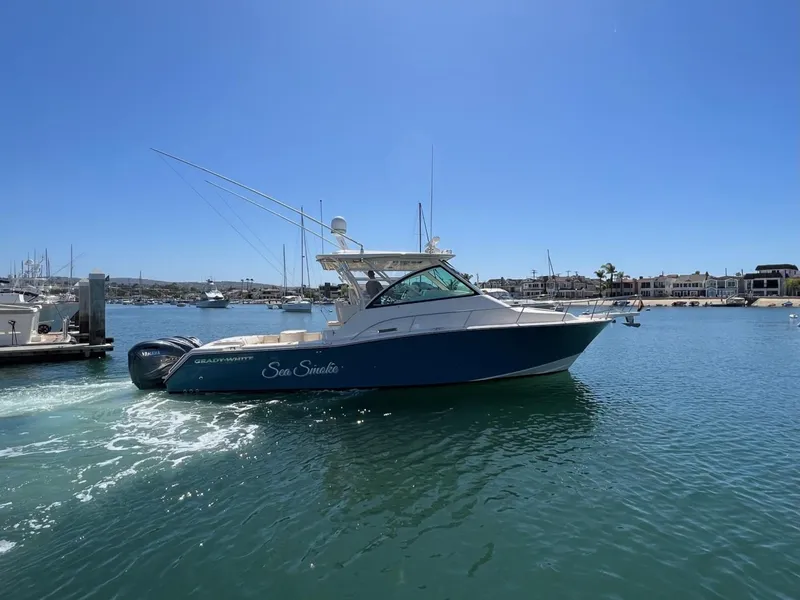 Slide: The Image of 2019 Grady-White Express 370 boat cruising in a sunny marina. - 18