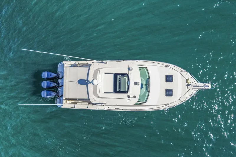 Slide: The Image of Aerial view of 2019 Grady-White Express 370 boat on clear blue water. - 21