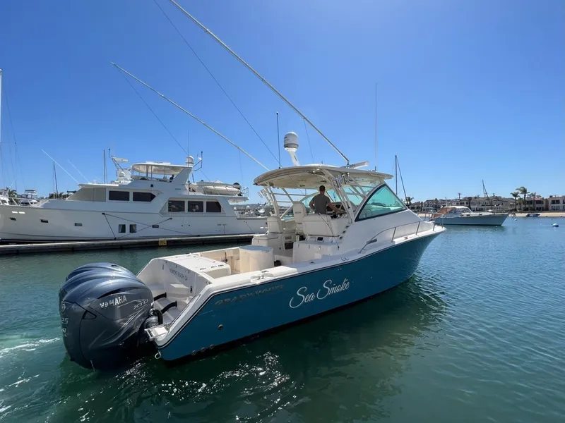 Slide: The Image of 2019 Grady-White Express 370 boat on water, sunny day, marina background. - 6