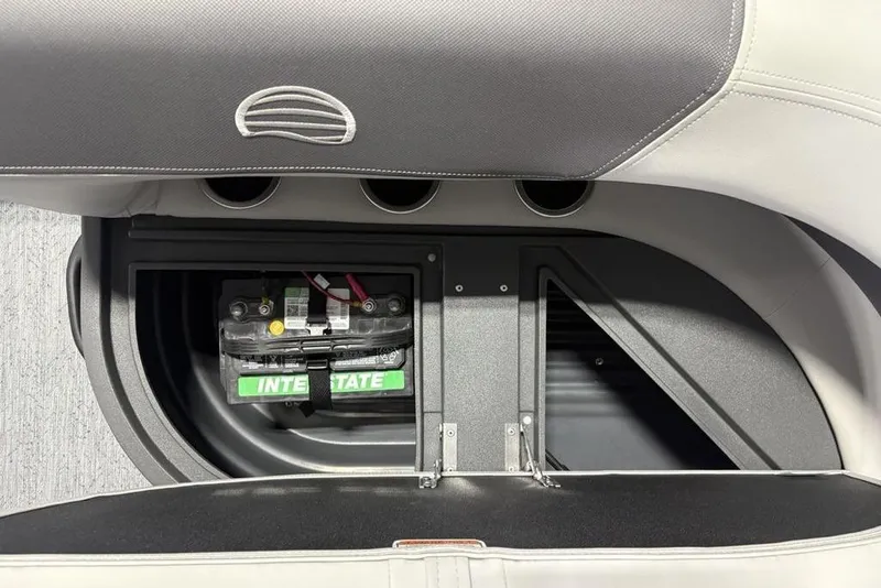 Slide: The Image of Sun Tracker Bass Buggy 16 XL Select 2026 boat battery compartment with Interstate battery. - 18