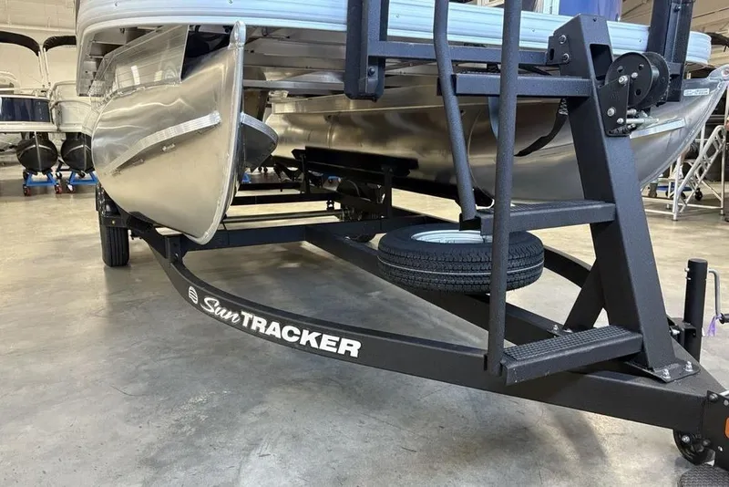 Slide: The Image of 2026 Sun Tracker Bass Buggy 16 XL Select on trailer in showroom. - 6