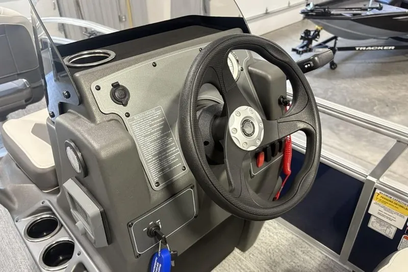 Slide: The Image of Steering console of 2026 Sun Tracker Bass Buggy 16 XL Select pontoon boat. - 11