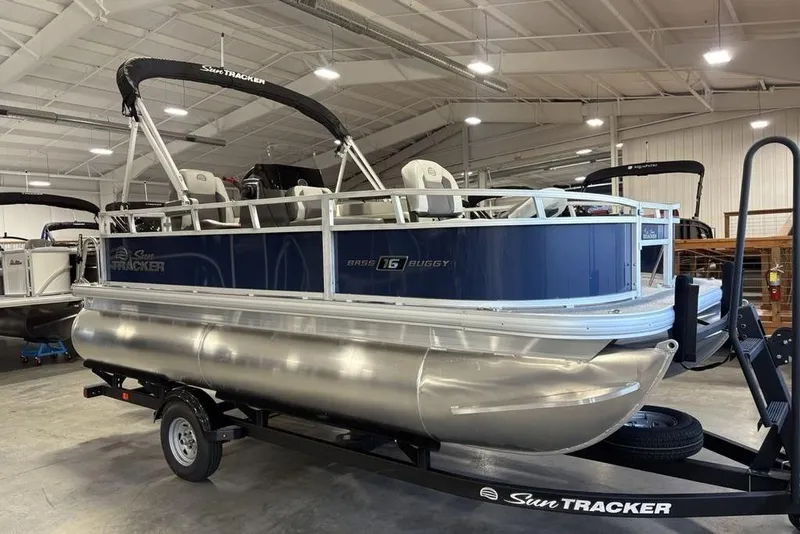 Slide: The Image of 2026 Sun Tracker Bass Buggy 16 XL Select pontoon boat in showroom. - 7